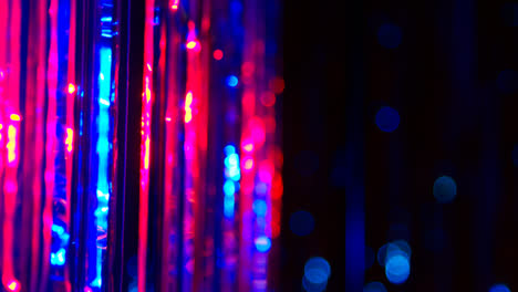 Defocused-Close-Up-Shot-Of-Sparkling-Tinsel-Curtain-In-Night-Club-Or-Disco